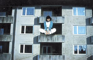 Regine in front of housing estates scenery